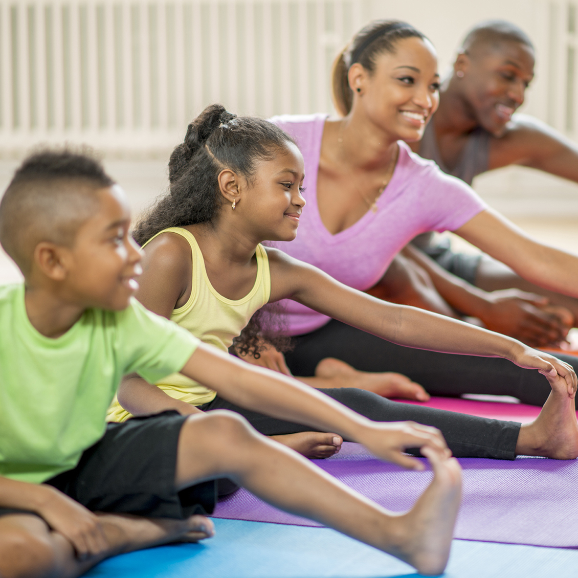 Family participating in yoga