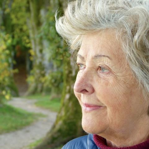 Older woman looking down path